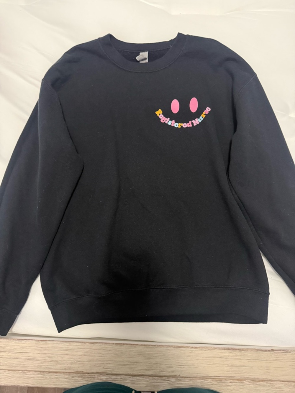 Gildan Black Nurse Crewneck Sweatshirt with Pink Smile Graphic